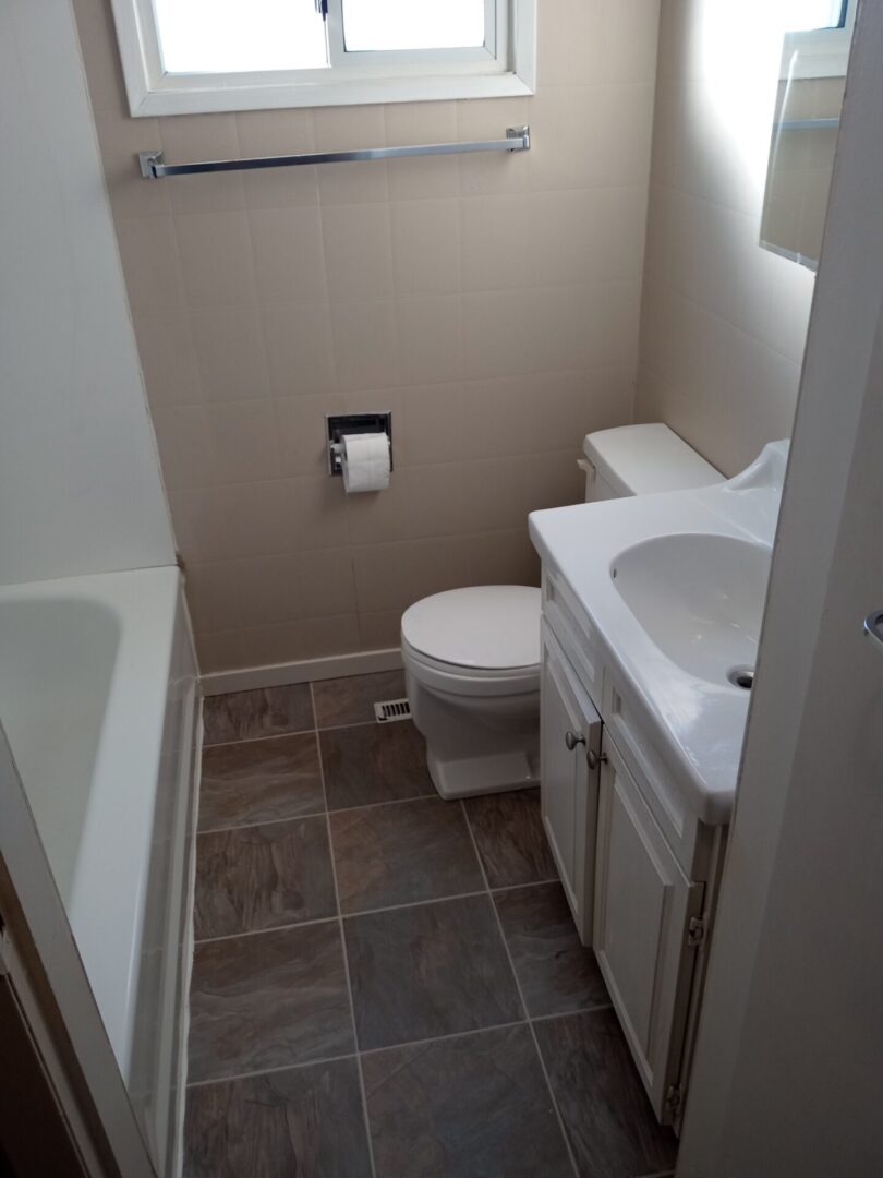 A small bathroom with a toilet and sink.